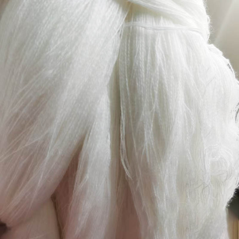 How can core-spun yarn achieve both high strength and an exceptionally soft feel?